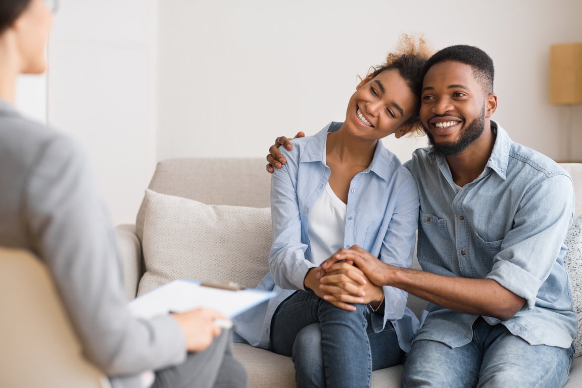 Afro Spouses Hugging Happily After Reconciling On Marital Counseling